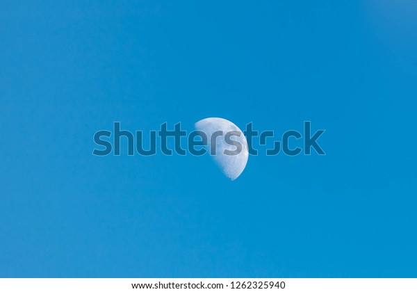 Half moon with blue\
sky, Moon background.
