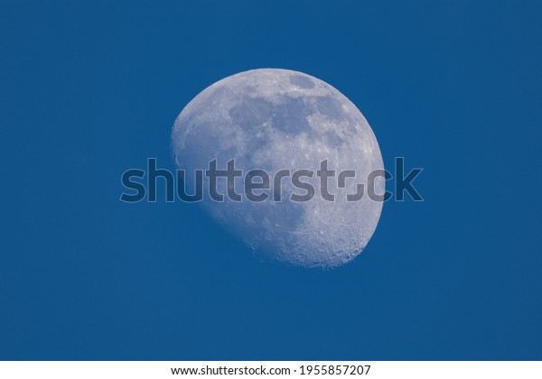 half moon at daytime and\
blue sky