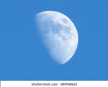 half moon during daylight
