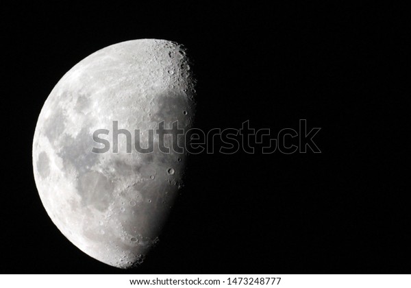 Half\
moon / Earth Moon is an astronomical body that orbits the planet\
and acts as its only permanent natural\
satellite.