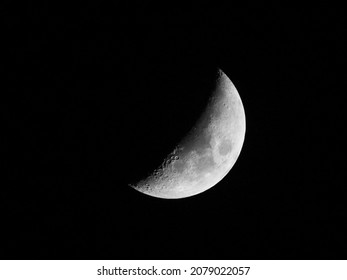 Half Moon Face In Dark Background