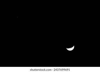 half moon and mars in the sky