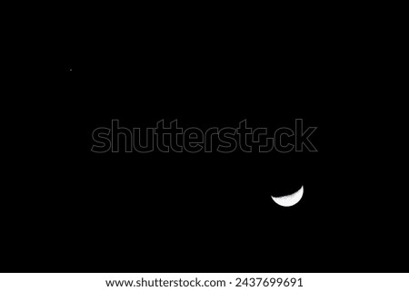 half moon and mars in the sky