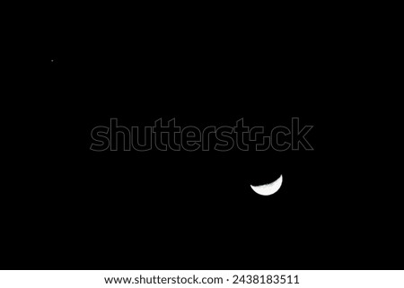 half moon and mars in the sky