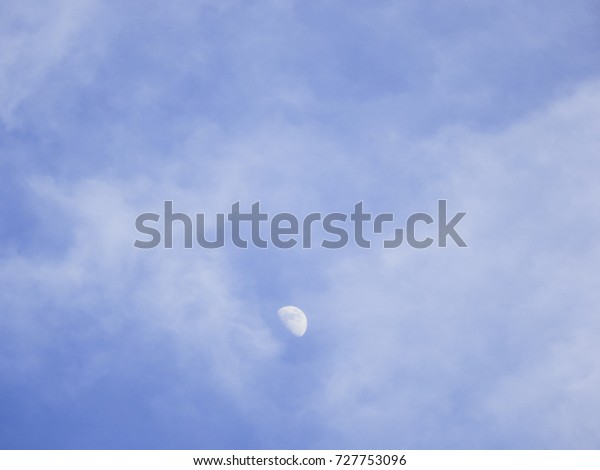 Half moon moving clouds in a\
day
