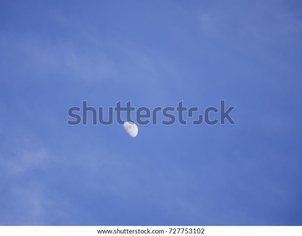 Half moon moving clouds in a\
day