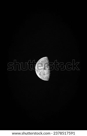 half moon in the night sky, photographed with a nikon d3200 dslr camera, and 75-300mm zoom lens