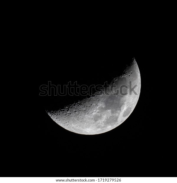 Half Moon as seen through a telescope. Details on\
the surface and a black night sky background. Taken on 29 April\
2020. First quarter