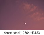 half moon and Venus arranging on sky in orange twilight sky