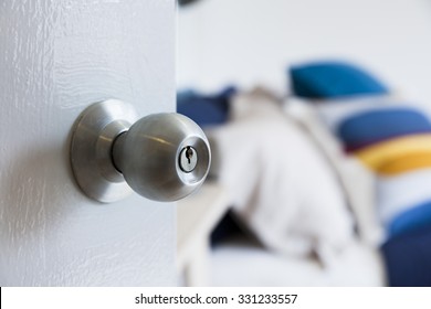 Half Opened Bedroom Door With Door Knob