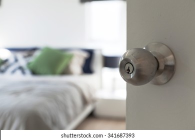 Half Opened Bedroom Door With Door Knob