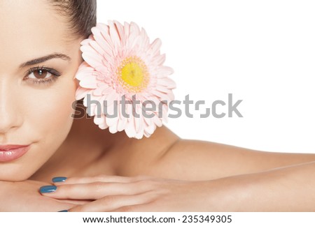 half ortrait of lying beautiful young woman with gerbera