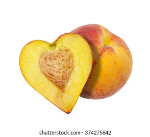 The half of the peach in the form of heart isolated on a white