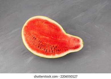 Half Of Pear-shaped Watermelon. Deformed Ugly Watermelon. Concept - Food Waste Reduction. Eating Imperfect Foods.