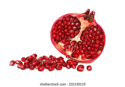 Half pomegranate with seeds isolated on white background