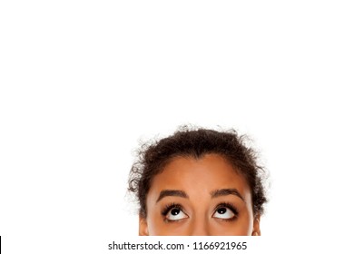 Half Portrait Of A Young Dark Skinned Girl Looking Up On White Background