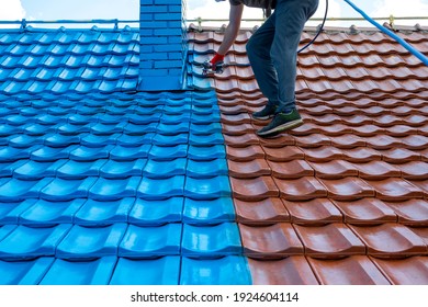 Half roof painted in blue, half of tiles are still red. Chimney is painted also. Before and after. Work at height.
