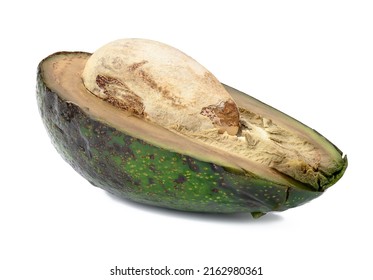 Half of rotten avocado with pit isolated on white background