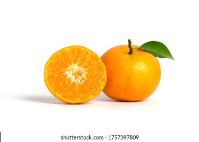 Half sliced and raw of Citrus sinensis ( called jeruk baby santang ) with leaves – local fresh fruit from Indonesia. Isolated fruit on a wooden basket / bowl. Image photo - Powered by Shutterstock