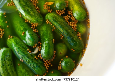 Half Sour Cucumber Pickles In Brine In A Barrel