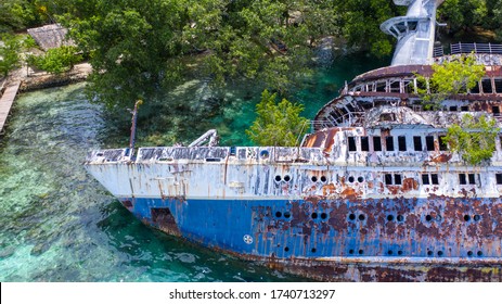 Half Sunken Ship At Roderick Bay In Solomon Island.