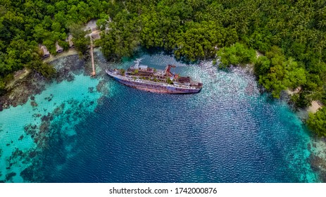 Half Sunken Ship At Roderick Bay In Solomon Islands