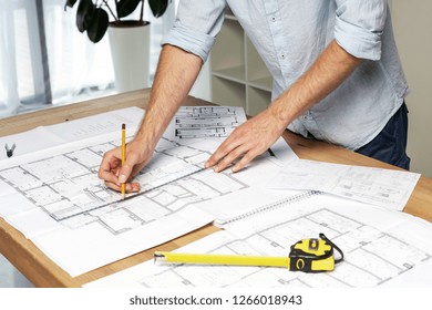 Half Turn Close Up Cropped Concentrated Focused Confident Success Man In Formal Wear Shirt Stand At The Table In Light Loft Interior Create Interior At New House