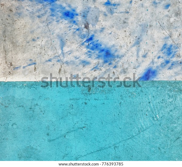 Half  turquoise blue half\
mortar color concrete wall with dark blue painted, two tone\
background