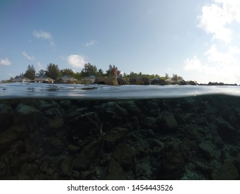 Half Underwater Shot With Water Villas