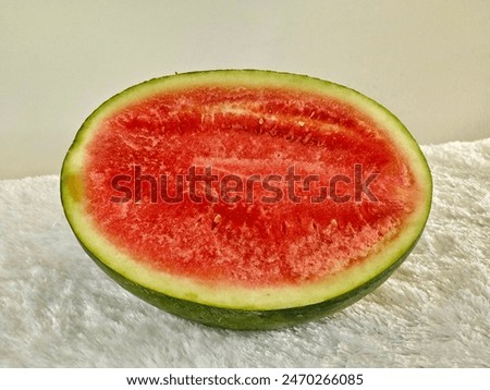 Half watermelon on the table. watermelon is highly cultivated fruit worlwide