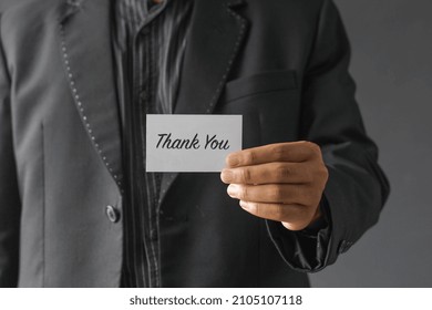 Half-body Portrait Of The Boss Showing A Note Saying Thank You To The Camera