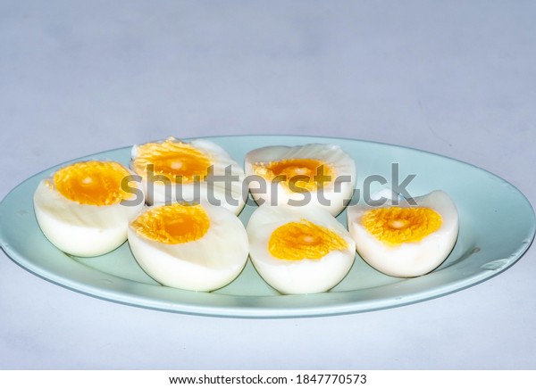 Half-boiled\
duck eggs, divided in half to put on a\
plate