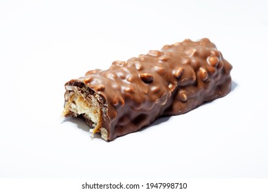 a half-eaten chocolate bar on a white background 