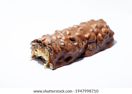 a half-eaten chocolate bar on a white background 