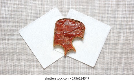 A Half-eaten Ketchup Sandwich On Paper Napkins. Top View.