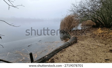 “A half-frozen lake in the mist.”