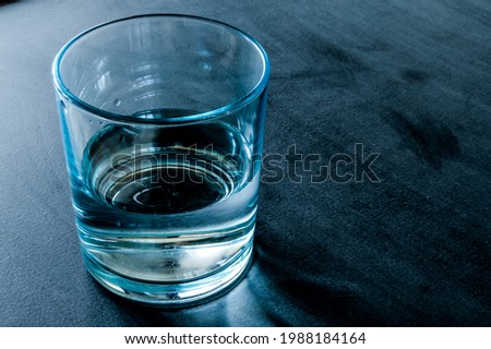 Half-full or half-empty glass of water, demonstrates the saying that opposes positivists and negativists, concept