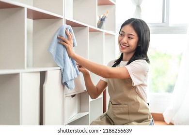 Half-Japanese housewife is cleaning the showcase and shelving in the living room, clean up on weekends, Big cleaning, Housework, Daily routine ,Removes germs and dirt and deep stains.