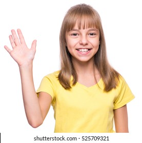 Half-length Emotional Portrait Of Caucasian Girl Wearing Yellow T-shirt. Funny Cute Child Looking At Camera Stretching Her Right Hand Up For Greeting, Isolated On White Background.