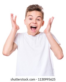 Half-length Emotional Portrait Of Caucasian Teen Boy Wearing White T-shirt. Funny Surprised Teenager Isolated On White Background. Handsome Child Looking At Camera.