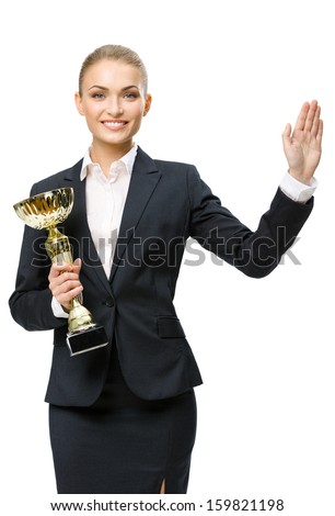 Half-length portrait of businesswoman keeping golden cup and waving her hand, isolated on white. Concept of victory and success