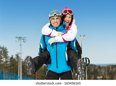 Half-length Portrait Of Happy Couple Of Skiers Have Fun. Concept Of Winter Sports And Cute Vacations