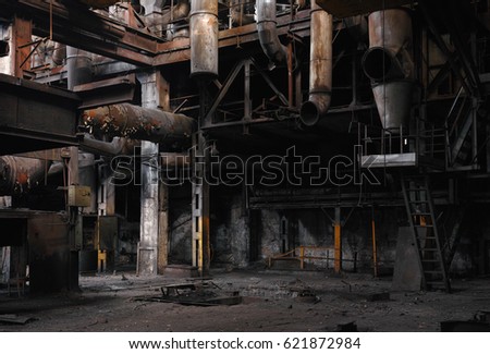 Half-ruined metal structures in an old abandoned factory.