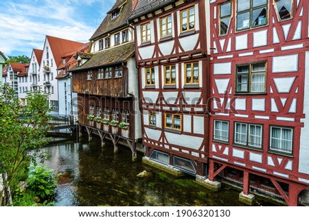 Half-timbered houses on old street of Ulm city, Germany. Nice view of typical facades in historical Fisherman`s Quarter. This place is famous landmark of Ulm. Canal in ancient district of Ulm town.