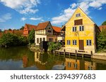 Half-Timbered Traditional Danish Houses near pond at Den Gamle By (The Old Town in English), an open-air town museum in Aarhus, Jutland, Denmark