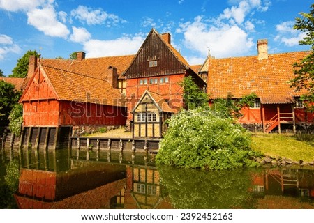 Half-Timbered Traditional Danish and Scandinavian Houses near pond at Den Gamle By (The Old Town in English), an open-air town museum located in the Aarhus, Denmark