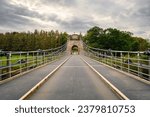 Halfway over the Union Chain Bridge, a suspension road bridge that spans the River Tweed between England and Scotland located four miles upstream of Berwick Upon Tweed