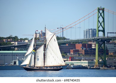 HALIFAX, CANADA - AUG 1, 2017: The Iconic Bluenose II During The Tall Ships Parade Of Sail In Halifax Harbour Near The Macdonald Bridge And Naval Base. The Original Is Featured On The Canadian Dime.