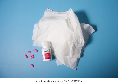 Halifax, Canada- June 1, 2019: Bunch Of Tissues For Allergies Along With Pink Pills And Bottle Of Benadryl 