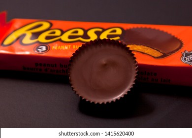 Halifax, Canada- May 31, 2019: Close Up Of A Reese's Peanut Butter Cup Against The Packaging 